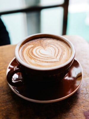 latte art in brown cup in macro photography